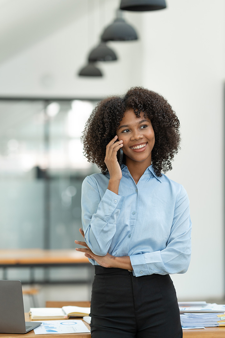 Voiceskycom - woman on the the phone discussing her telecom needs